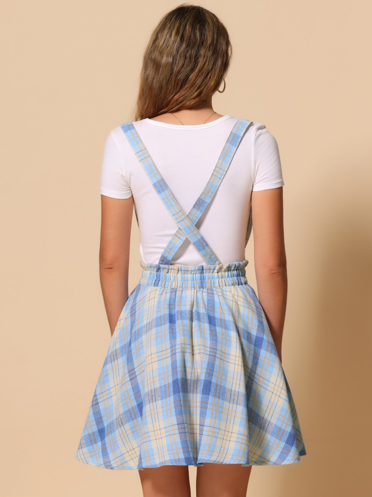 Falda skater acampanada con tirantes y botones decorados con cuadros escoceses para mujer