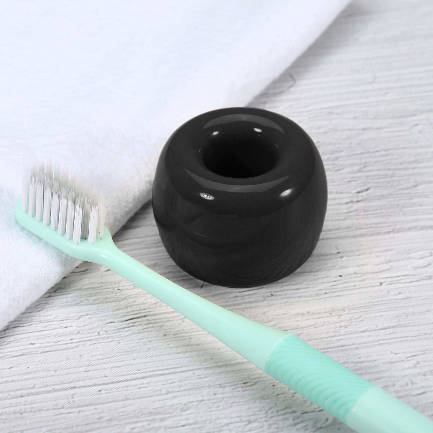 Mini portacepillos de dientes redondo de cerámica para baño, 4,2 x 3 cm, color negro